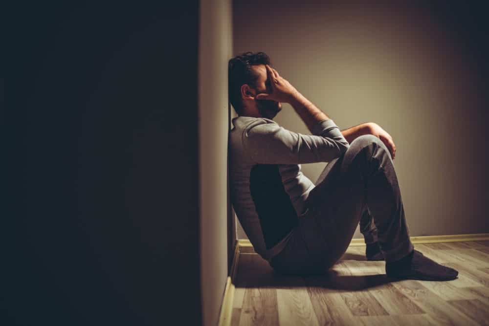 Man with tense expression, text "Toxic Masculinity." Highlights cultural pressure to be "tough" and how suppressing emotions harms men's mental health.